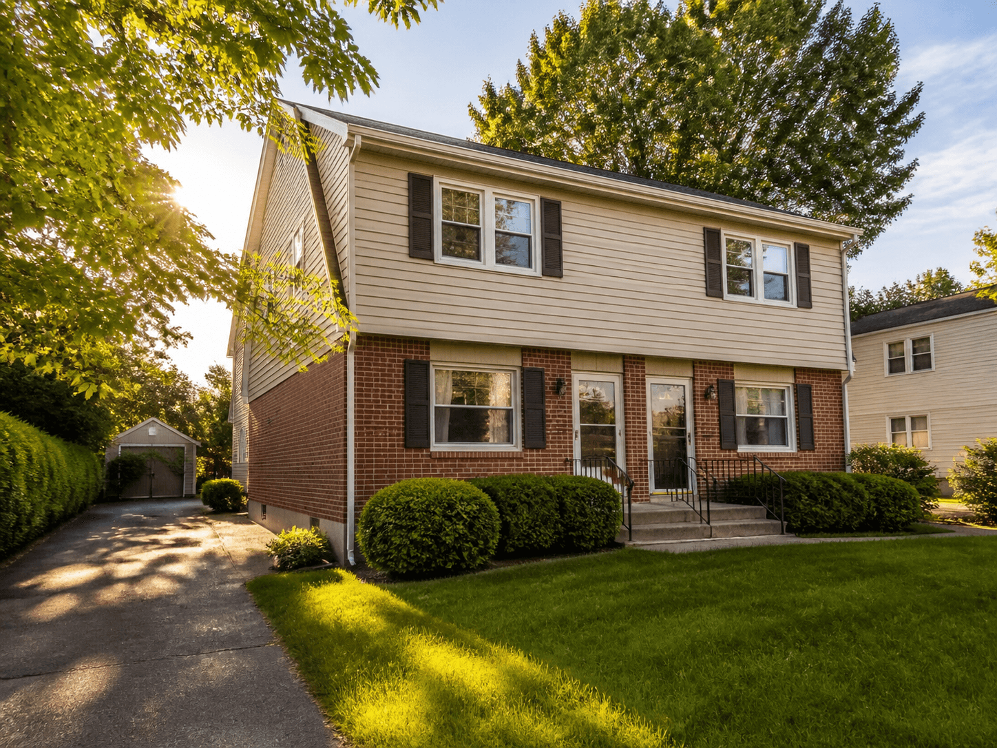 Single-family duplex with a front porch and lawn